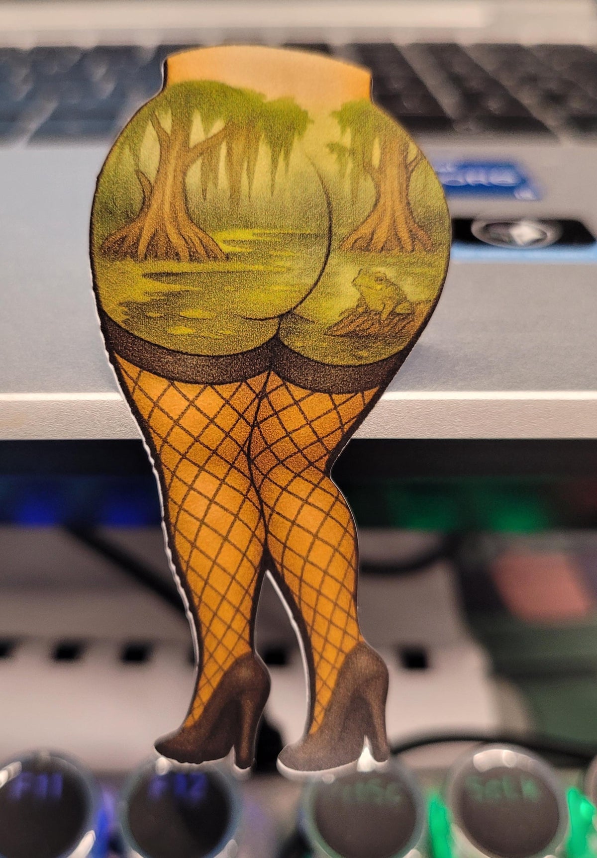 Swamp Booty Sticker – Fishnet Legs, Frog & Bayou Scene – Funny Cheeky Pin-Up Style Vinyl Decal